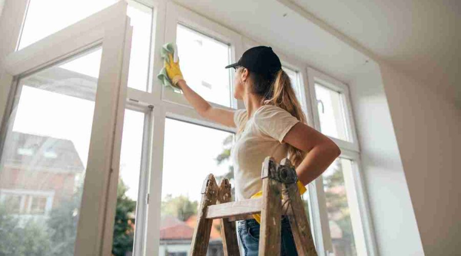 a woman cleaning the window